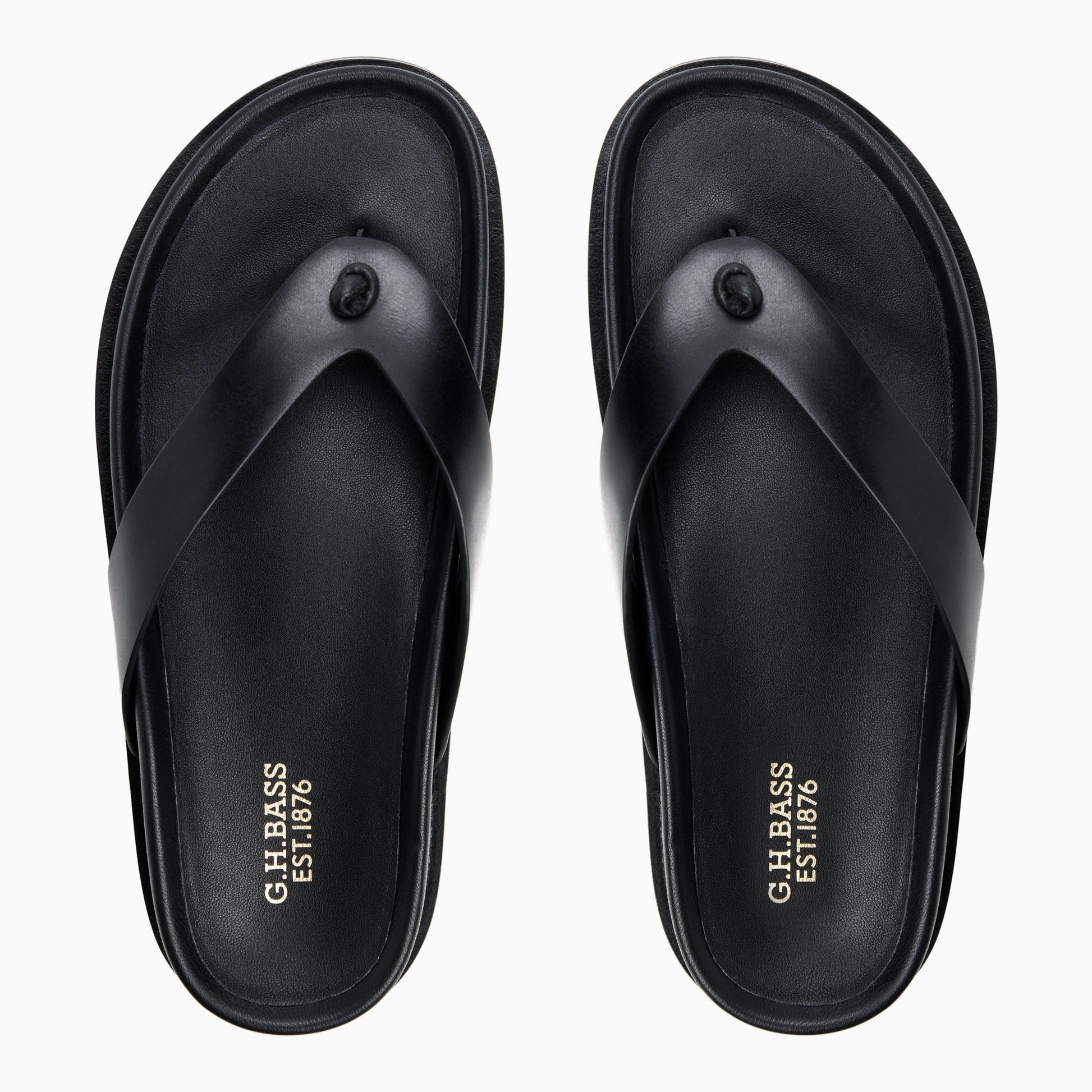Three-quarter angle of Black Womens Wynn Footbed Thong Sandal Footbed Thong Sandals's front side